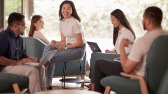Students relaxing and studying in the common lounge at UNSW Kensington accommodation.